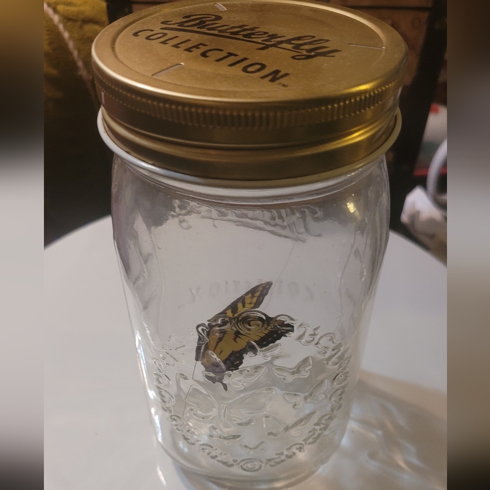 Butterfly flying in a jar (fake)